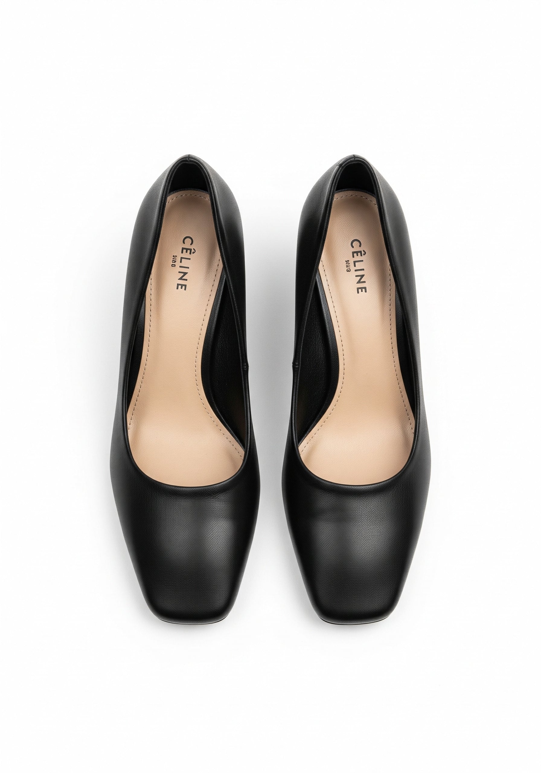 Pair of black high-heeled shoes on a white background